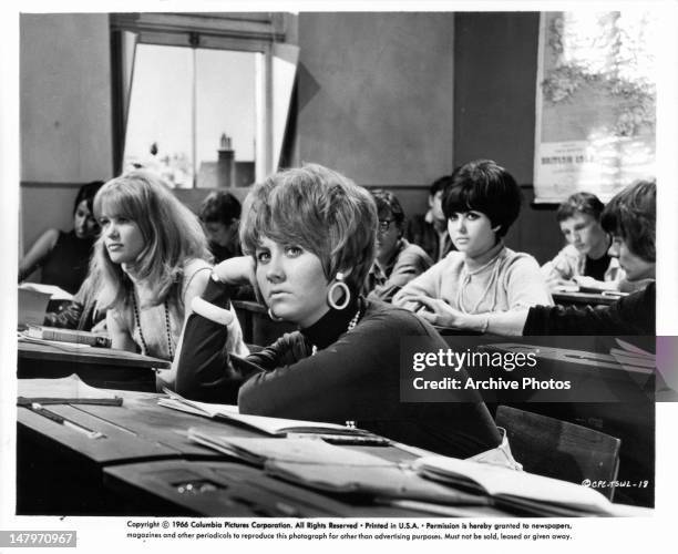 Judy Geeson and other classmates sitting in classroom in a scene from the film 'To Sir, With Love', 1967.