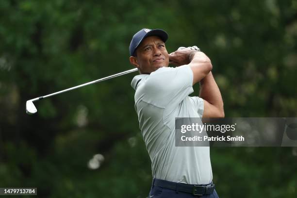 Tiger Woods of the United States plays his shot from the fourth tee during a practice round prior to the 2023 Masters Tournament at Augusta National...