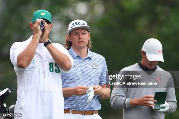 Cameron Smith of Australia talks with his caddie Sam Pinfold on the fourth tee during a practice round prior to the 2023 Masters Tournament at...