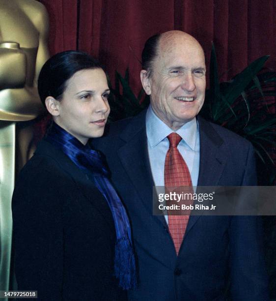 Robert Duvall and Luciana Pedraza arrive at the Annual Academy Awards Nominees Luncheon, March 9,1998 in Beverly Hills, California.