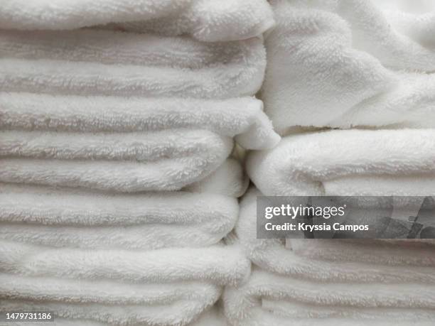 stack of white towels - towel texture stock pictures, royalty-free photos & images