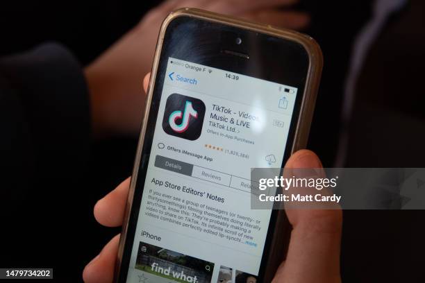 In this photo illustration, a 11-year-old boy looks at the TikTok app on a smartphone screen in the village of St Jean d'Aulps on April 04, 2023 near...