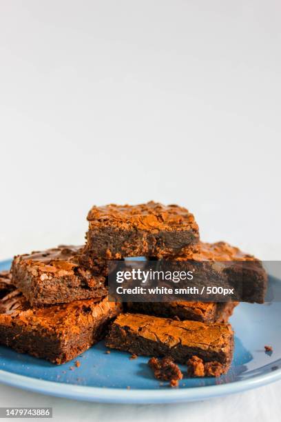 close-up of cake in plate against white background,chicago,illinois,united states,usa - chicago sweets stock pictures, royalty-free photos & images