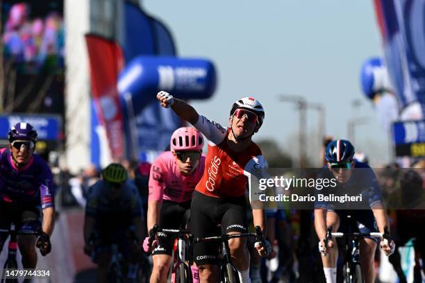 Bryan Coquard of France and Team Cofidis celebrates at finish line as stage winner ahead of Marijn van den Berg of The Netherlands and Team EF...