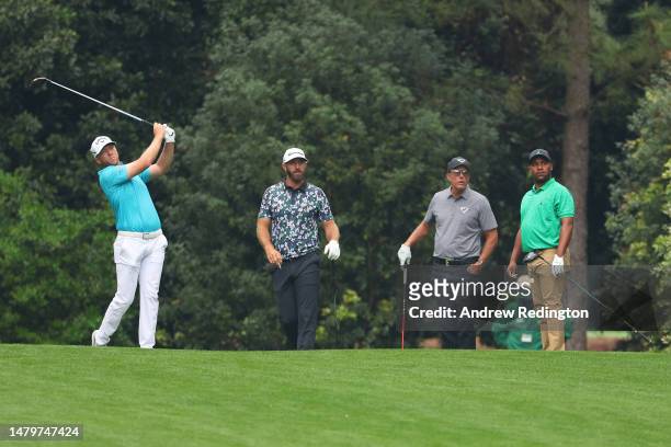 Talor Gooch of the United States plays a shot as Dustin Johnson of the United States, Phil Mickelson of the United States and Harold Varner III of...