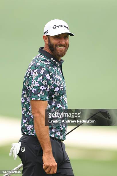 Dustin Johnson of the United States looks on from the 10th green during a practice round prior to the 2023 Masters Tournament at Augusta National...