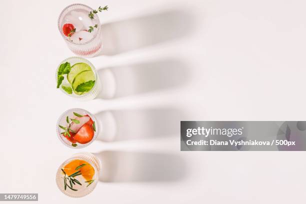 infused waters with different flavors,summer refreshing drinks in a ribbed glasses,top view,dublin,california,united states,usa - limonade stockfoto's en -beelden
