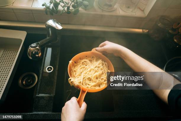 preparing food at home in the kitchen. cooking food - coador imagens e fotografias de stock