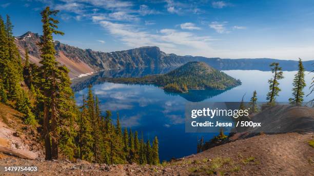 panoramic view of lake and mountains against sky,crater lake national park,oregon,united states,usa - oregon imagens e fotografias de stock