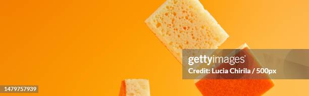 close-up of bread slices against orange background,romania - cheddar cheese stock pictures, royalty-free photos & images