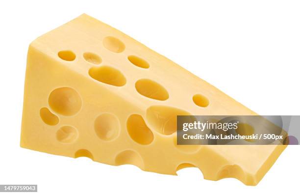 close-up of cheese against white background - maasdamer stock-fotos und bilder
