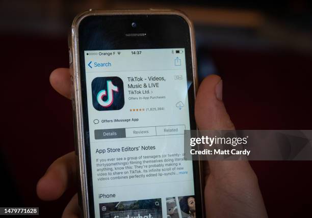 In this photo illustration, a 11-year-old boy looks at the TikTok app on a smartphone screen in the village of St Jean d'Aulps on April 04, 2023 near...