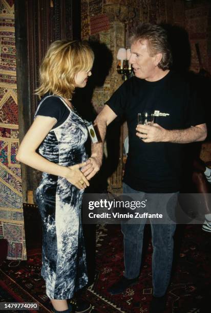 Rosanna Arquette and Graham Nash attend an event, 1994.