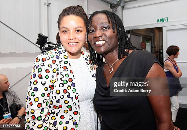 Auma Obama and daughter Akini pose backstage ahead of the Minx By Eva Lux Show at Mercedes-Benz Fashion Week Spring/Summer 2013 on July 7, 2012 in...