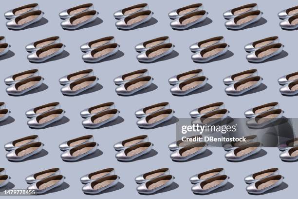 pattern of pairs of women's silver shoes with low heels, on a gray-blue background. concept of feminine, party, footwear, feet, dress low heel, classic, elegant and comfort. - ladies day stock pictures, royalty-free photos & images