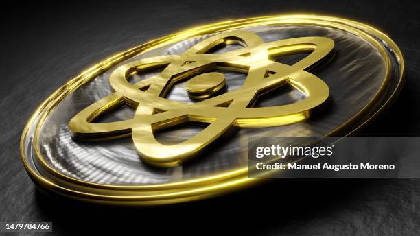 generic coin with the atomic energy symbol - uranio fotografías e imágenes de stock