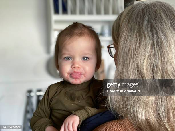 grandmother with her sick baby granddaughter - myocarditis stock pictures, royalty-free photos & images