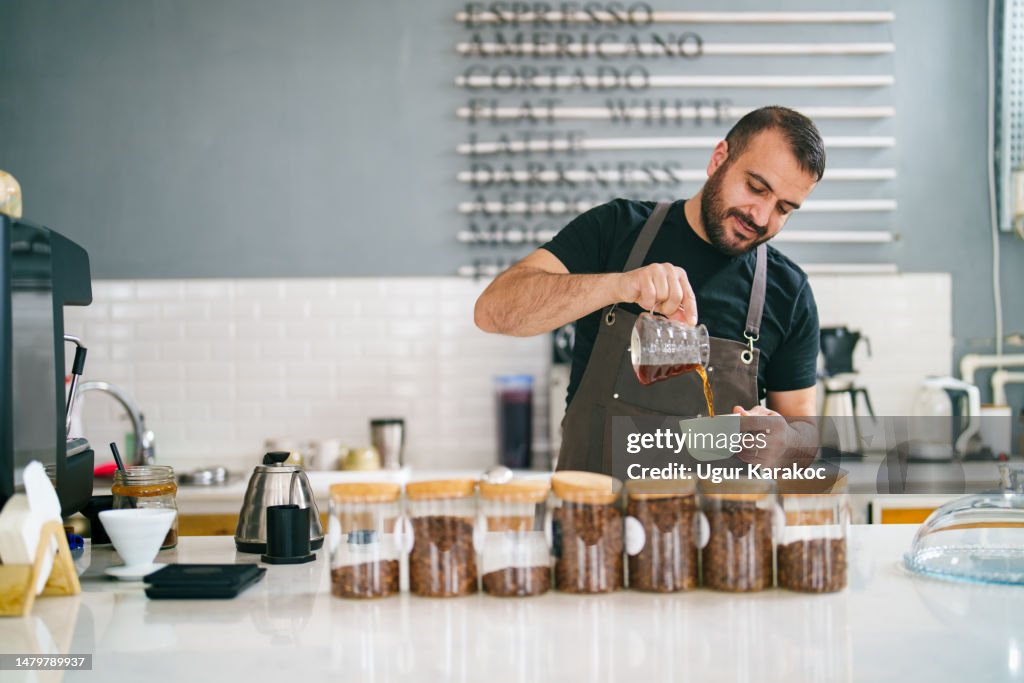 Barista pouring coffee to cup, Coffee Shop Small Business