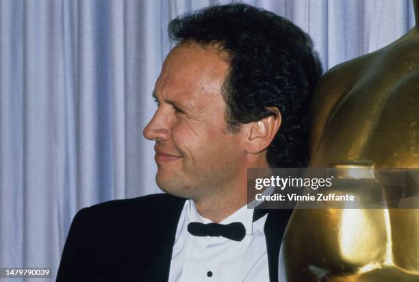 Billy Crystal attends the Annual Academy Awards, United States, circa 1990s.