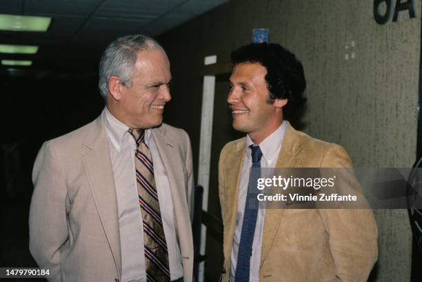 Alan King and Billy Crystal attends an event, United States, circa 1980s.