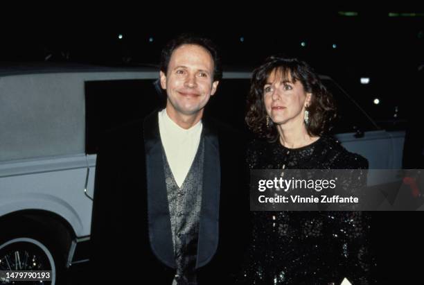 Billy Crystal and wife - Producer Janice Crystal attend a red carpet event, United States, circa 1990s.