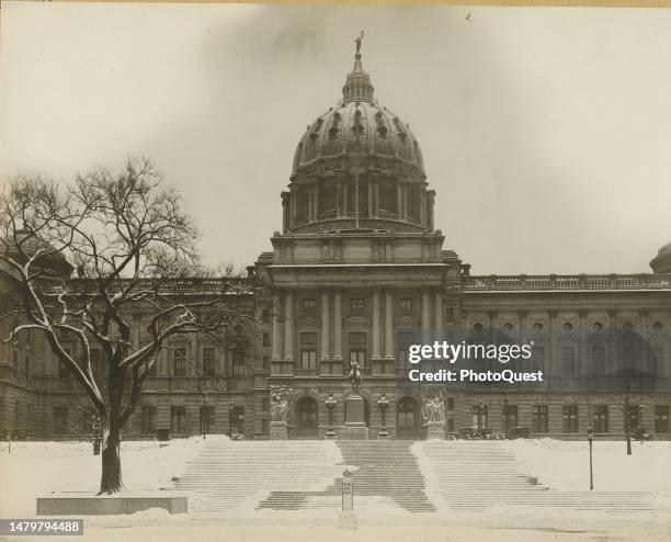 View of the Pennsylvania State Capitol building, its steps covered in snow, Harrisburg, Pennsylvania, 1928.