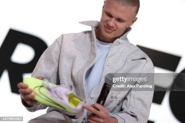 April 04: Erling Haaland appeared on stage at NikeTown with Alex Scott during Nike's celebration moment for Haaland extending his partnership with...