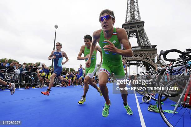 British athlete William Clark and Spanish Javier Gomez Noya compete during the 6th edition of the Paris triathlon on July 7, 2012 in Paris. The...