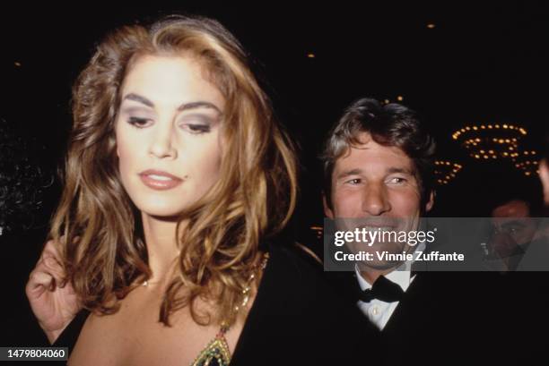 Richard Gere and Cindy Crawford attend a red carpet event, United States, circa 1990s.
