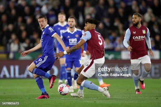 Jamie Vardy of Leicester City battles for possession with Tyrone Mings of Aston Villa during the Premier League match between Leicester City and...