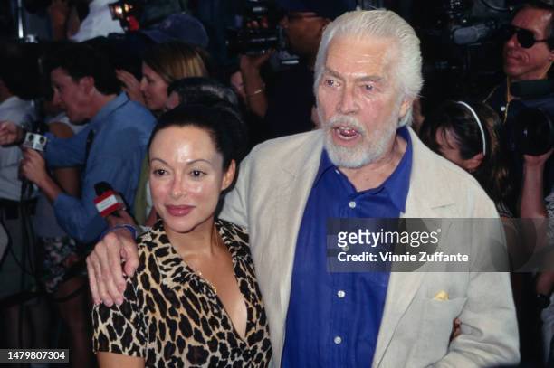 James Coburn and Paula Coburn attend the World Premiere of 'Conspiracy Theory' at Mann's Village Theater in Westwood, California, United States, 4th...