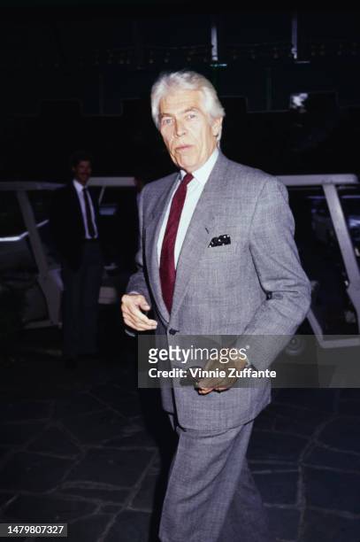 James Coburn attends an event, United States, circa 1990s.