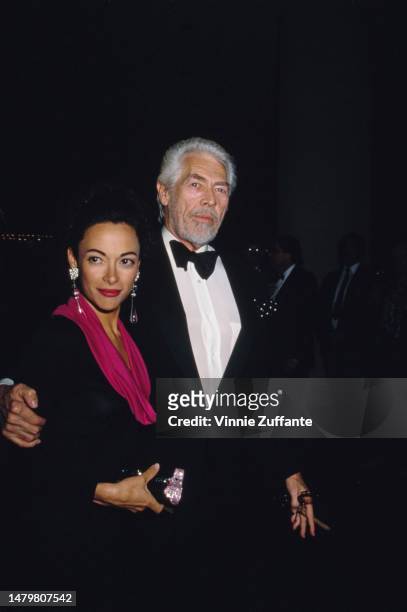 James Coburn and date Paula Murad attend the 19th Annual American Film Institute Lifetime Achievement Award Salute to Kirk Douglas at Beverly Hilton...