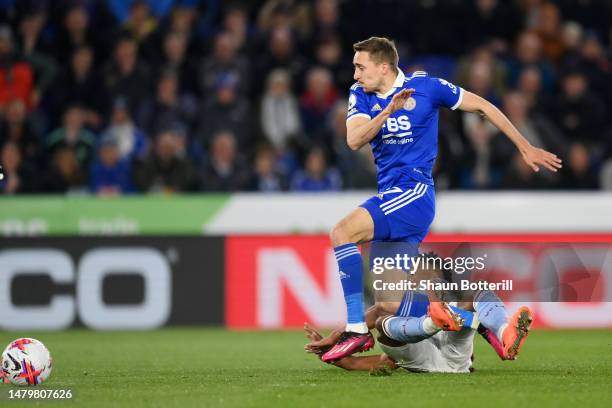 Ollie Watkins of Aston Villa scores the team's first goal while under pressure from Timothy Castagne of Leicester City during the Premier League...