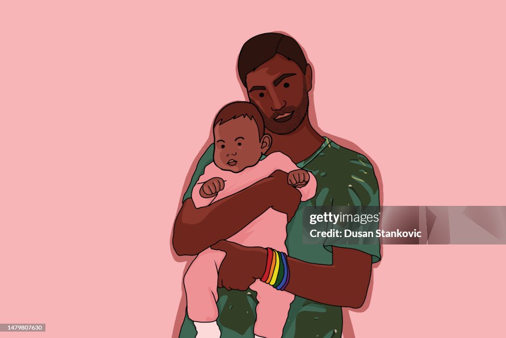 LGBT father holding a baby