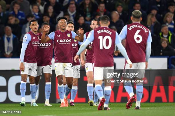 Ollie Watkins of Aston Villa celebrates with teammates after scoring the team's first goal during the Premier League match between Leicester City and...