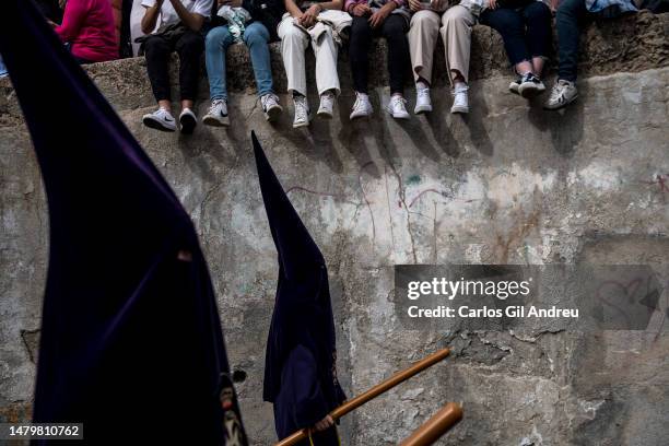 Penitents of the Via Crucis brotherhood take part in the Holy Tuesday procession in the Albaicín neighborhood on April 04, 2023 in Granada, Spain. In...