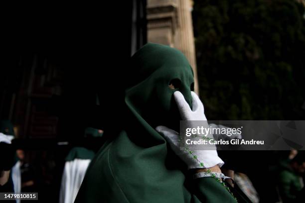 Penitent of the "Esperanza" brotherhood takes part in the procession on Holy Tuesday on April 04, 2023 in Granada, Spain. In the last week of Lent,...