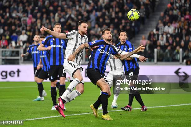 Federico Gatti of Juventus and Francesco Acerbi of FC Internazionale battle for the ball during the Coppa Italia Semi Final match between Juventus FC...