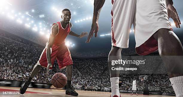 action-basketball player - dribbling sports stock-fotos und bilder