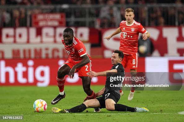 Dayot Upamecano of FC Bayern Munich battles for possession with... News ...