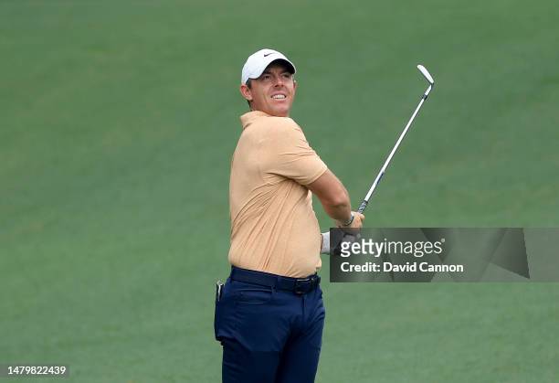 Rory McIlroy of Northern Ireland plays his second shot on the ninth hole during practice prior to the 2023 Masters Tournament at Augusta National...