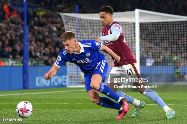 Harvey Barnes of Leicester City is challenged by Jacob Ramsey of Aston Villa during the Premier League match between Leicester City and Aston Villa...