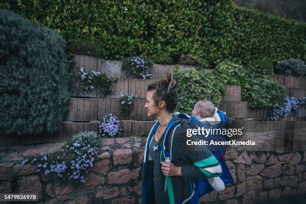 mother and infant explore residential area - pure stockfoto's en -beelden