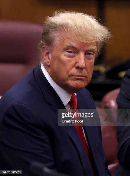 Former U.S. President Donald Trump sits in the courtroom during his arraignment at the Manhattan Criminal Court April 4, 2023 in New York City. Trump...