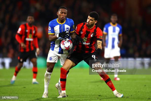 Pervis Estupinan of Brighton & Hove Albion and Dominic Solanke of AFC Bournemouth battle for the ball during the Premier League match between AFC...