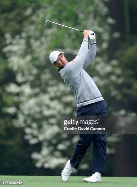 Adam Scott of Australia plays his second shot on the 11th hole during practice prior to the 2023 Masters Tournament at Augusta National Golf Club on...