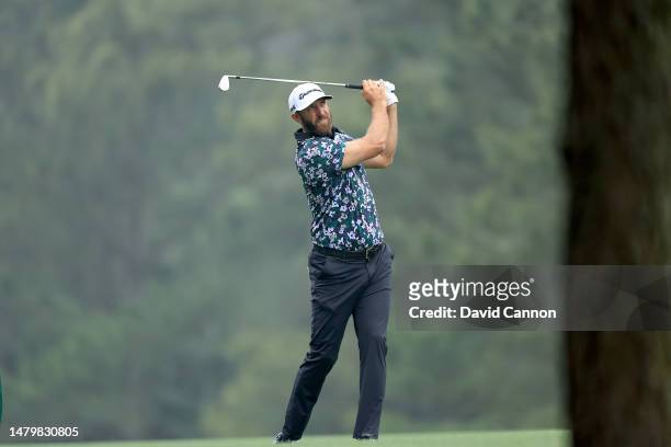 Dustin Johnson of The United States plays his second shot on the 14th hole during practice prior to the 2023 Masters Tournament at Augusta National...