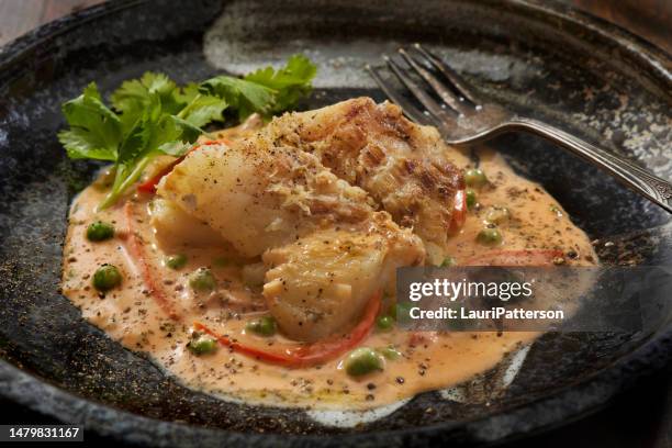 baked cod fillets with a thai ginger coconut curry sauce - fillet steak stock pictures, royalty-free photos & images