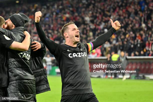 Christian Guenter of Sport-Club Freiburg celebrates towards the fans after the team's victory in the DFB Cup quarterfinal match between FC Bayern...